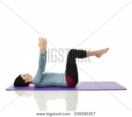 Mother Woman Exercising Doing Postnatal Workout. Female Fitness Instructor Stretching Hands And Legs