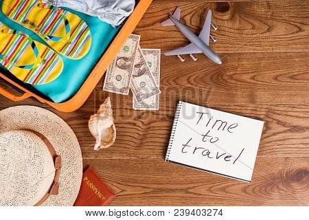Beach Accessories On Wooden Table. Flat Lay, Time To Travel Concept.
