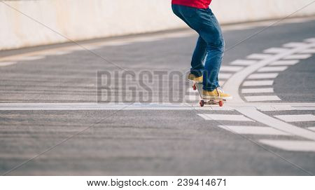 One Young Skateboarder Sakteboarding On High Way