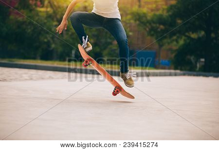 One Young Skateboarder Sakteboarding On Parking Lot