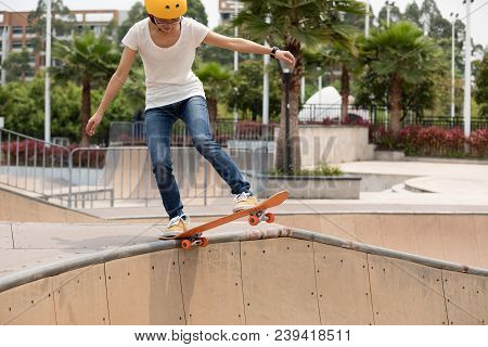 One Young Skateboarder Sakteboarding On Skatepark Ramp