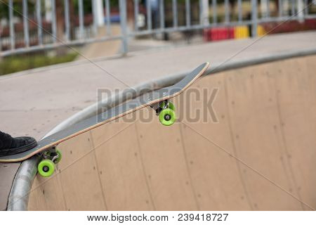 One Young Skateboarder Sakteboarding On Skatepark Ramp