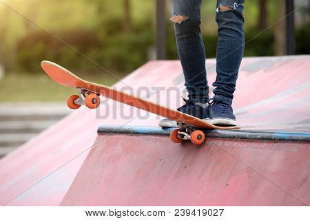 One Young Skateboarder Sakteboarding On Skatepark Ramp