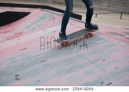 One Young Skateboarder Sakteboarding On Skatepark Ramp