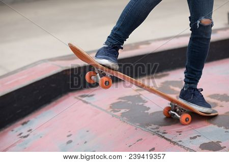 One Young Skateboarder Sakteboarding On Skatepark Ramp