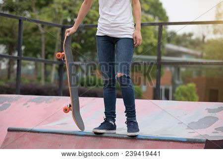 One Young Skateboarder Sakteboarding On Skatepark Ramp