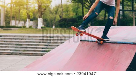 One Young Skateboarder Sakteboarding On Skatepark Ramp