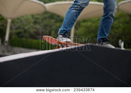 Closeup Of One Skateboarder Sakteboarding On Skatepark