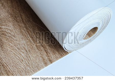 Roll Of Linoleum On A White Background