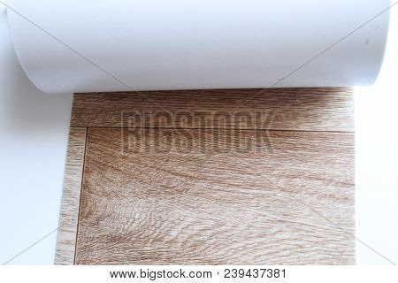 Roll Of Linoleum On A White Background