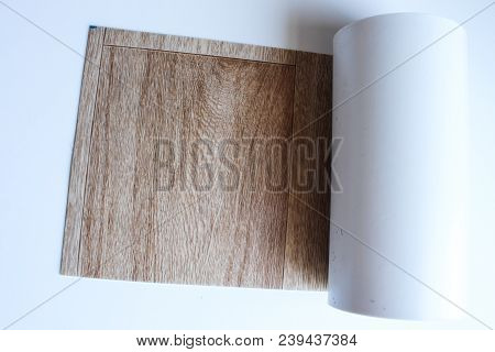 Roll Of Linoleum On A White Background