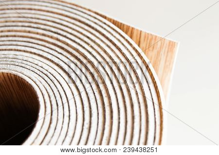 Roll Of Linoleum On A White Background