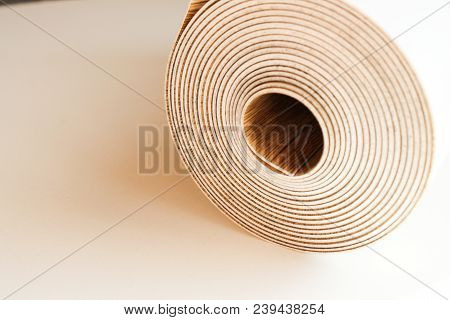 Roll Of Linoleum On A White Background
