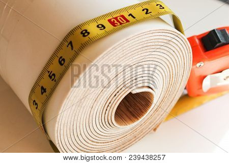 Roll Of Linoleum On A White Background