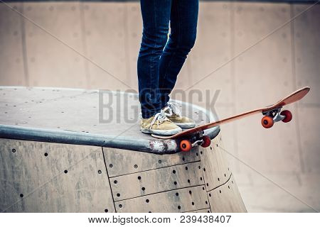 One Young Skateboarder Sakteboarding On Skatepark Ramp