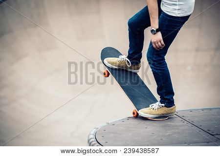 One Young Skateboarder Sakteboarding On Skatepark Ramp