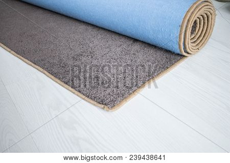 Home Floor Carpet With Overlock On White Laminate.