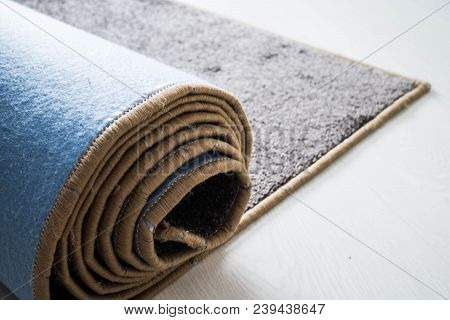 Home Floor Carpet With Overlock On White Laminate.