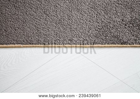 Home Floor Carpet With Overlock On White Laminate.