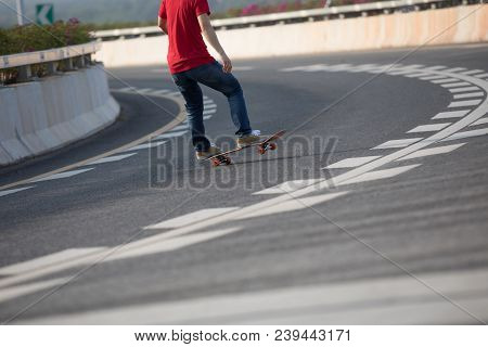 Closeup Of Skateboarder Sakteboarding On City Highway