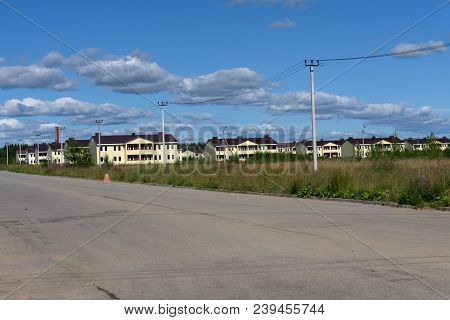 Brick Two-storey Cottages On The Street Near The City Outskirts. Two-storey Houses On The Street, Bl