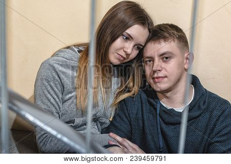 Homeless Teenagers Boyfriend And Girlfriend Sit On The Steps In Block Of Flats