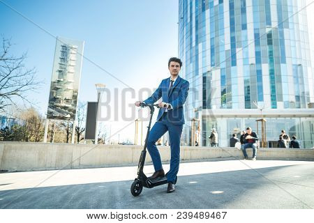 Using Electric Scooter On The Street