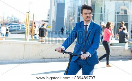 Using Electric Scooter On The Street