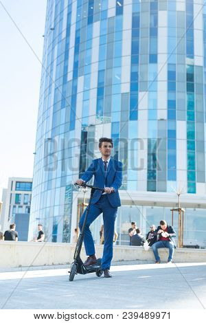 Using Electric Scooter On The Street