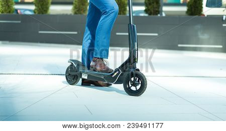 Using Electric Scooter On The Street