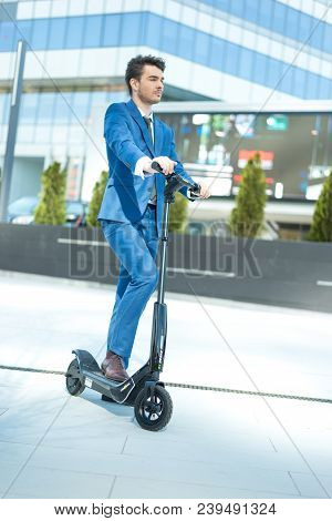 Using Electric Scooter On The Street