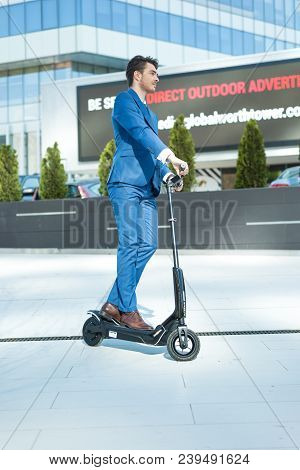Using Electric Scooter On The Street