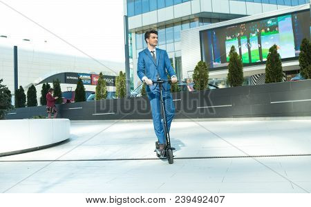 Using Electric Scooter On The Street