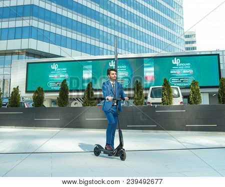Using Electric Scooter On The Street