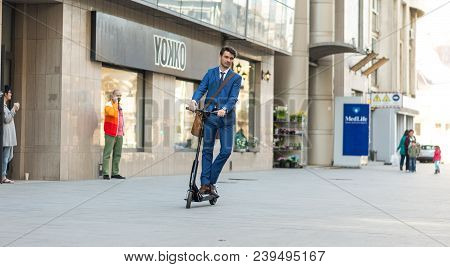 Using Electric Scooter On The Street