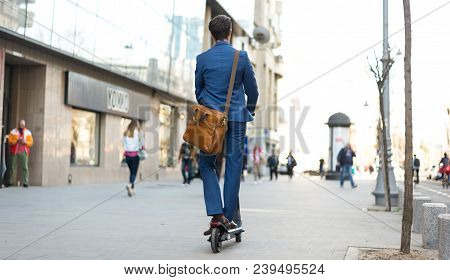 Using Electric Scooter On The Street