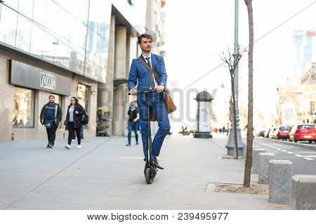 Using Electric Scooter On The Street