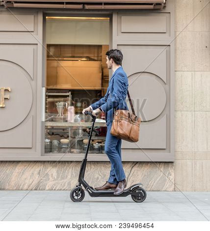 Bucharest, Romania, - Octomber 26, 2017: Using Electric Scooter On The Street On A Sunny Day With Sa
