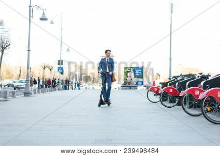 Bucharest, Romania, - Octomber 26, 2017: Using Electric Scooter On The Street On A Sunny Day With Sa