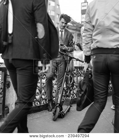 Bucharest, Romania, - Octomber 26, 2017: Using Electric Scooter On The Street On A Sunny Day With Sa