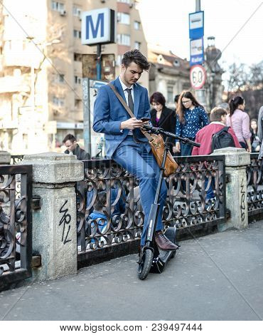 Bucharest, Romania, - Octomber 26, 2017: Using Electric Scooter On The Street On A Sunny Day With Sa