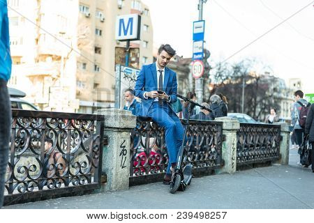 Bucharest, Romania, - Octomber 26, 2017: Using Electric Scooter On The Street On A Sunny Day With Sa