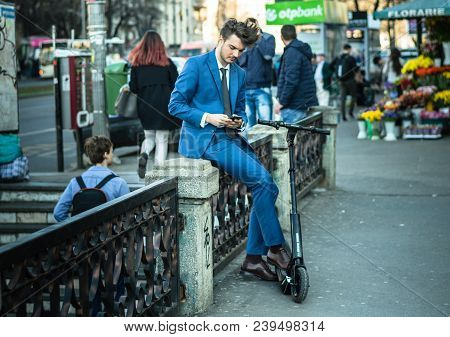 Bucharest, Romania, - Octomber 26, 2017: Using Electric Scooter On The Street On A Sunny Day With Sa