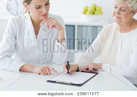 Elderly Woman Choosing Diet Plan