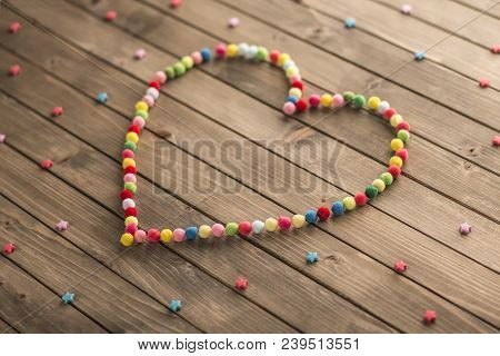 Handmade Wooden Heart On Wooden Background. Handmade Love Decoration. Wooden Background With Hearts.