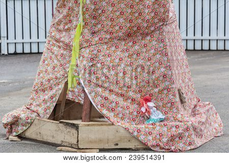 The Motanka Doll At The Base Of The Scarecrow