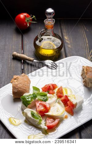Caprese Salad With Tomatoes, Basil,  Mozzarella Balls, Made With White Ball Mozzarella Buffalo Itali