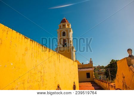 Trinidad, Cuba. The Bell Tower Of San Francisco De Asis Against The Blue Sky.
