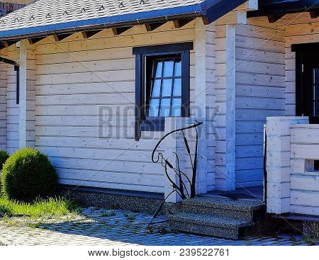 House of laminated veneer lumber with a green Bush