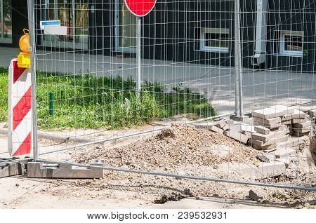 Replacement Of The Paving Tiles Or Cobblestone Bricks Of The Pedestrian Sidewalk In The City With Co